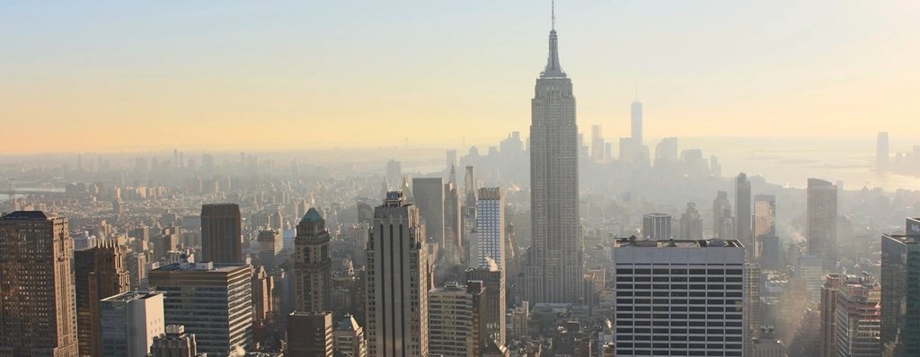 A financial district skyline at dusk