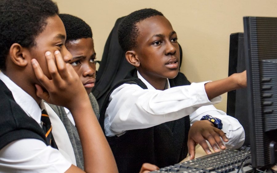 Students working together at a computer